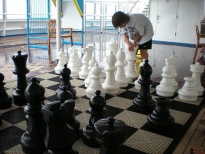 Playing giant chess with Aaron on Carnival Glory.