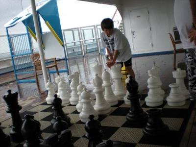 Playing giant chess with Aaron on Carnival Glory.