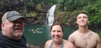 Wet afternoon at Weimea Falls.  Got to the top and it started raining hard.  Julie and Aaron stepped in the pool below t