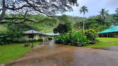 Wet afternoon at Weimea Falls.  Got to the top and it started raining hard.  Julie and Aaron stepped in the pool below t