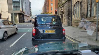 Black Taxi Tours.  If you're not familiar with Irish history there's been a conflict between the Catholics and Protestan