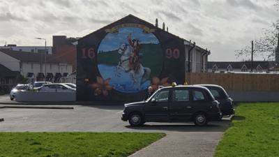 Black Taxi Tours.  If you're not familiar with Irish history there's been a conflict between the Catholics and Protestan