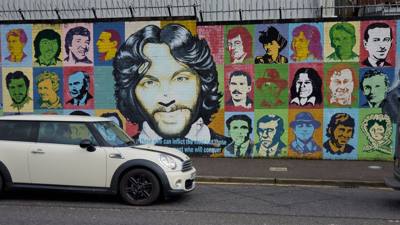 Black Taxi Tours.  If you're not familiar with Irish history there's been a conflict between the Catholics and Protestan