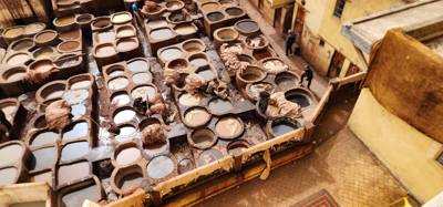 The visit to the leather area of the Fes Medina market was interesting.  They cure and dye the leather in these big pots