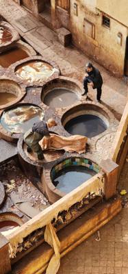 The visit to the leather area of the Fes Medina market was interesting.  They cure and dye the leather in these big pots