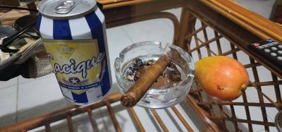 New evening pre-bed ritual unlocked.  A Cuban cervesa, a Cuban cigar and a mango handed to me by wait staff in a bar.  O